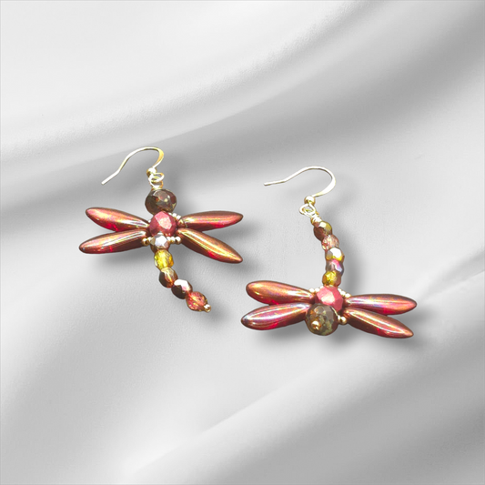 a pair of red and gold dragonfly earrings