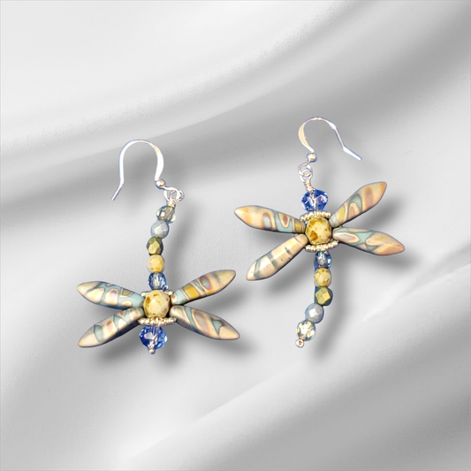 a pair of dragonfly earrings with blue and yellow beads